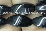 CAA2482 15.5 inches 6*12mm twisted rice black agate beads