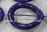 CTU1866 15.5 inches 32*40mm twisted oval donut synthetic turquoise beads