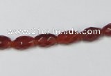 CAA124 15.5 inches 6*10mm faceted rice red agate gemstone beads