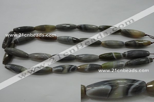 CAG3958 15.5 inches 10*30mm faceted rice grey botswana agate beads