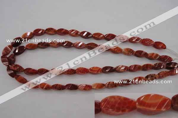 CAG4181 15.5 inches 7*14mm faceted & twisted rice natural fire agate beads