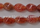 CAG4184 15.5 inches 6*10mm twisted rice natural fire agate beads