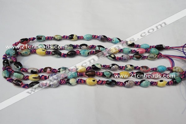 CAG5770 15 inches 6*9mm faceted rice fire crackle agate beads