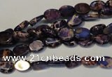 CDE414 15.5 inches 6*8mm oval dyed sea sediment jasper beads