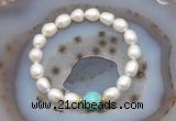 CFB926 9mm - 10mm rice white freshwater pearl & blue sea sediment jasper stretchy bracelet