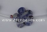 CFG1006 15.5 inches 20mm carved flower blue spot stone beads