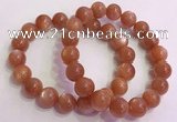 CGB4541 7.5 inches 12mm - 13mm round golden sunstone beaded bracelets