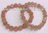 CGB4587 7.5 inches 8mm - 9mm round sunstone beaded bracelets