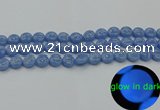 CLU131 15.5 inches 10mm flat round blue luminous stone beads