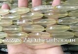 CRI132 15.5 inches 10*30mm faceted rice lemon quartz beads