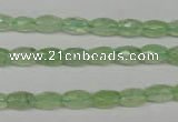 CRU165 15.5 inches 5*8mm faceted rice green rutilated quartz beads