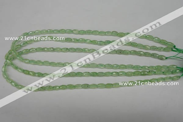 CRU165 15.5 inches 5*8mm faceted rice green rutilated quartz beads